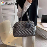 Quilted Shoulder Bag with Pompom Pendant