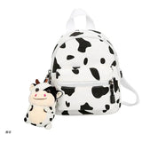 D0UD Mini Canvas Daypack with Plush Pendant Cow Print Backpack for Women