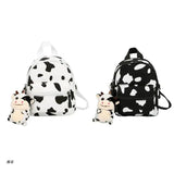 D0UD Mini Canvas Daypack with Plush Pendant Cow Print Backpack for Women