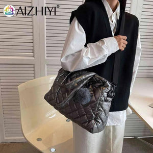 Quilted Shoulder Bag with Pompom Pendant