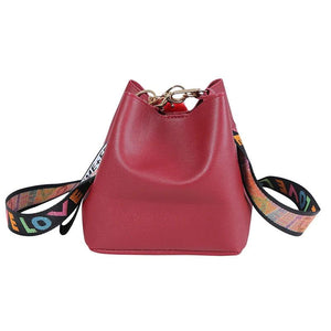 Small Bucket Crossbody Bag with Fur Ball and Wide Strap