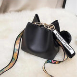 Small Bucket Crossbody Bag with Fur Ball and Wide Strap