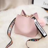 Small Bucket Crossbody Bag with Fur Ball and Wide Strap