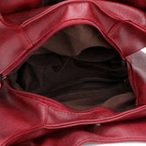 Women's Leather Crossbody Bag with Tassel Detail