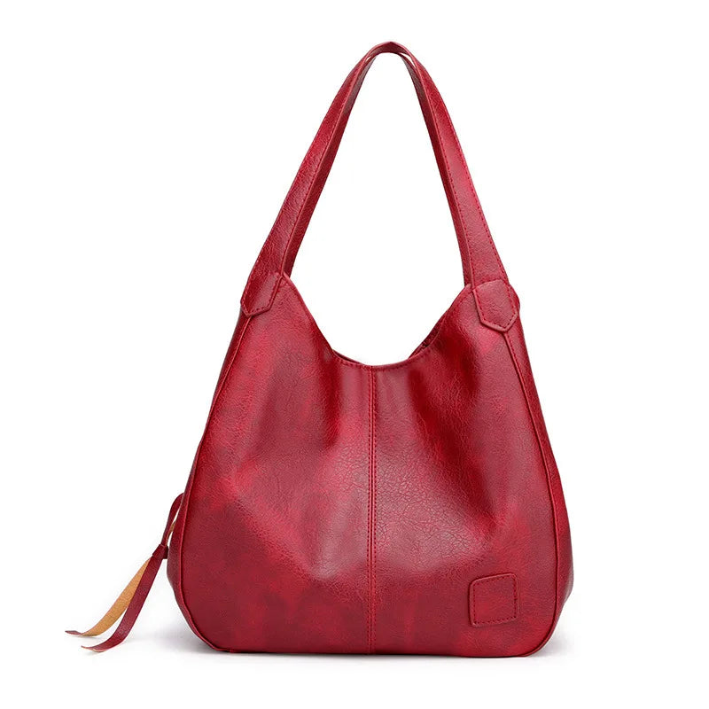Women's Leather Crossbody Bag with Tassel Detail