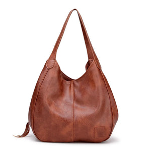 Women's Leather Crossbody Bag with Tassel Detail