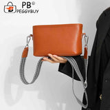 Crossbody Bag with Wide Fabric Strap in Cowhide Leather