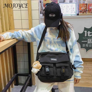 Women's Crossbody Bag with Pockets and Pendant - Zipper Closure