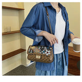 Solid Diamond Inlaid Leather Crossbody Bag with Peacock Chain