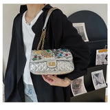 Solid Diamond Inlaid Leather Crossbody Bag with Peacock Chain
