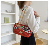 Solid Diamond Inlaid Leather Crossbody Bag with Peacock Chain
